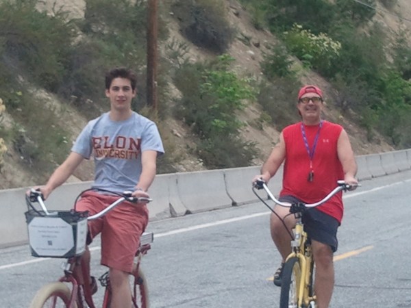 a person riding a bicycle on a mountain road