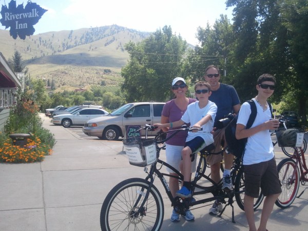 a man riding on the back of a bicycle