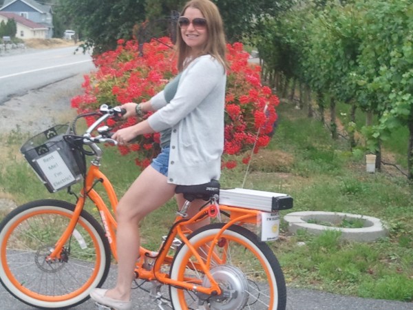 a person riding on the back of a bicycle