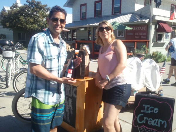 a man and a woman standing in front of a building