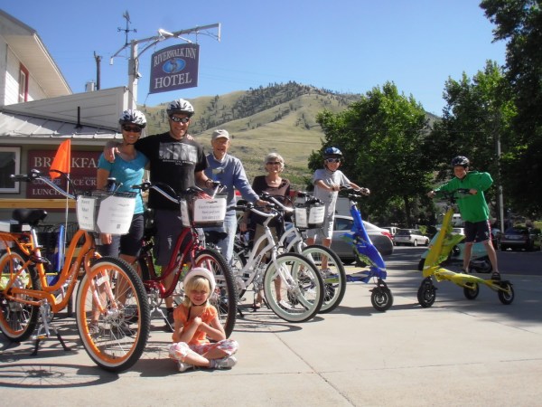 a group of people riding on the back of a motorcycle