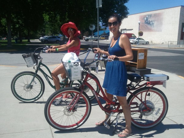 a person riding on the back of a bicycle