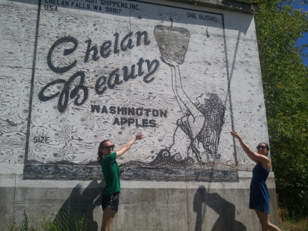 a man with graffiti on the side of a building