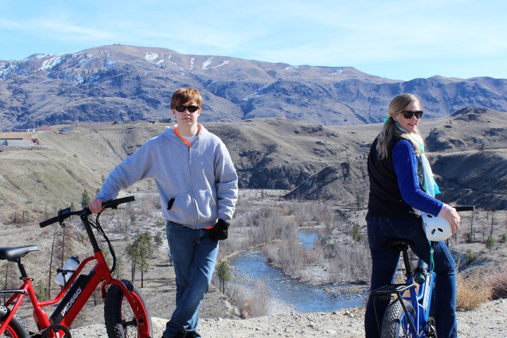 a group of people standing on top of a mountain