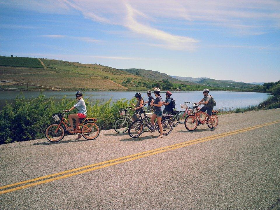 Manson Back Road and Winery Tour Image 1 a group of people riding on the back of a bicycle